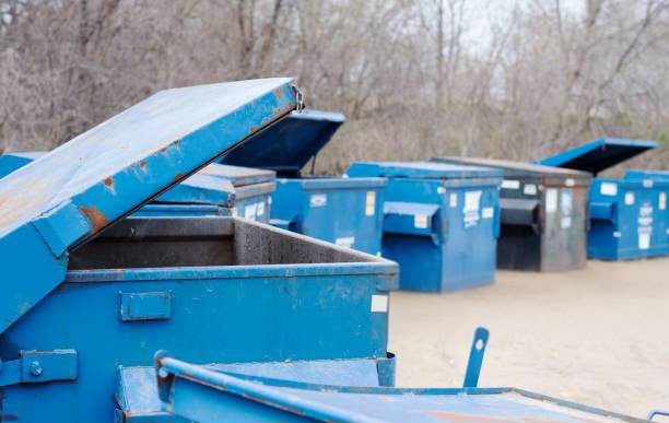 blue containers, some open ready for garbage, waste.